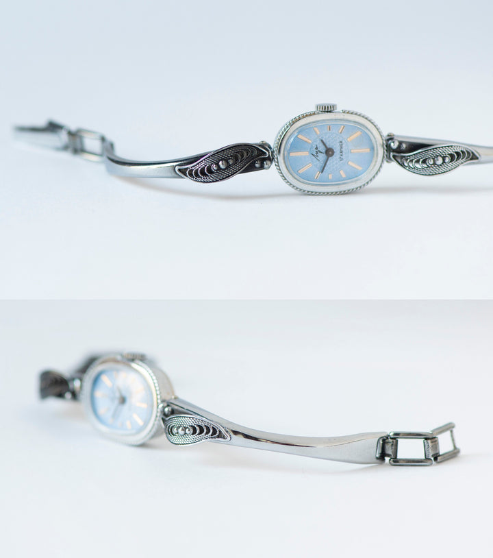 Mint condition women cocktail watch oval blue dial leaf trim on bangle, vintage watch for women Ray silver shade, classic jewelry bracelet