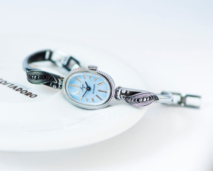 Mint condition women cocktail watch oval blue dial leaf trim on bangle, vintage watch for women Ray silver shade, classic jewelry bracelet