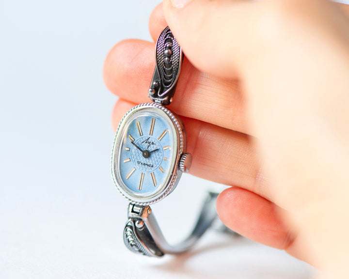 Mint condition women cocktail watch oval blue dial leaf trim on bangle, vintage watch for women Ray silver shade, classic jewelry bracelet