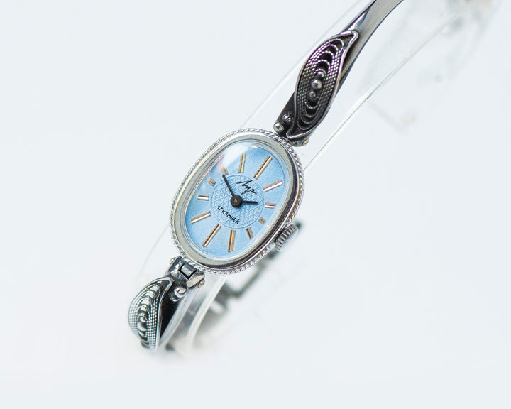 Mint condition women cocktail watch oval blue dial leaf trim on bangle, vintage watch for women Ray silver shade, classic jewelry bracelet