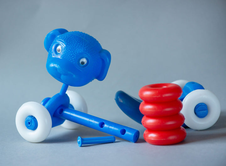 Vintage plastic dog puppy toy assembled kid's toy, blue red white white on wheels doggy moving neck toy eye rolling dog nursery room decor